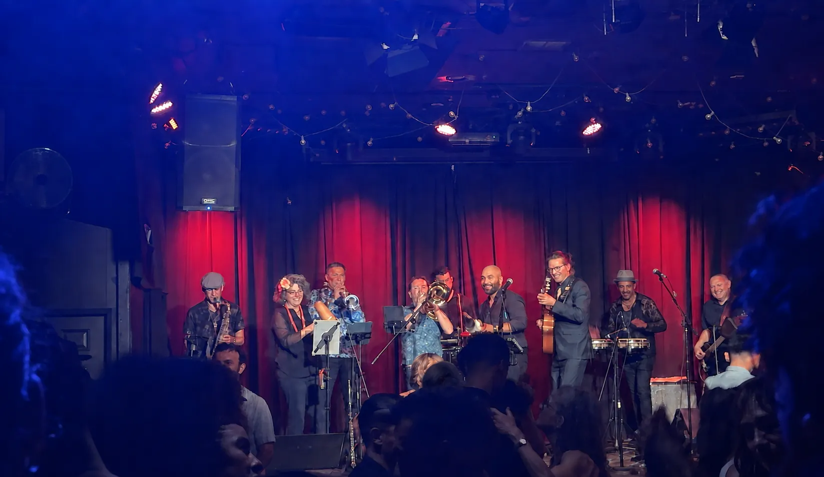Guajirón's full orchestra performing as couples dance at La Peña Cultural Center